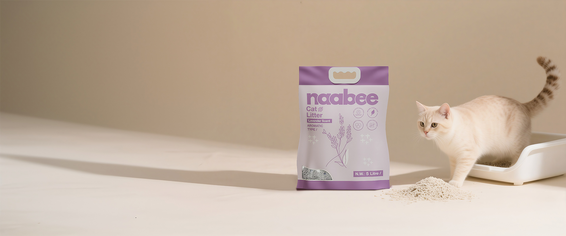 naabee cat litter packaging with a cat on a light-colored floor